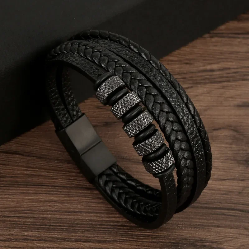 Pulsera negra de 4 tiras con broche y apliques de acero negro