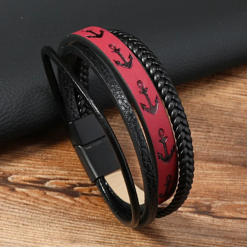 Pulsera roja y negra con anclas labradas