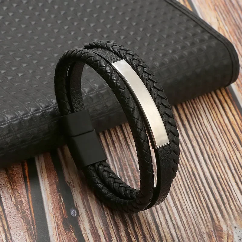 Pulsera triple negra con aplique plateado