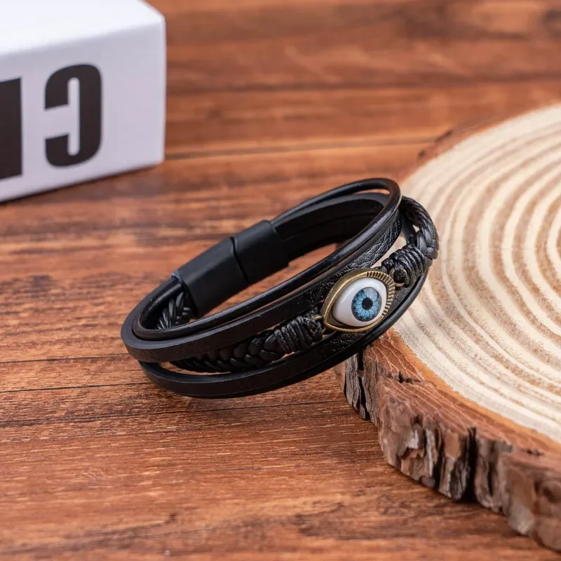 Pulsera negra de 5 tiras y dije de ojo