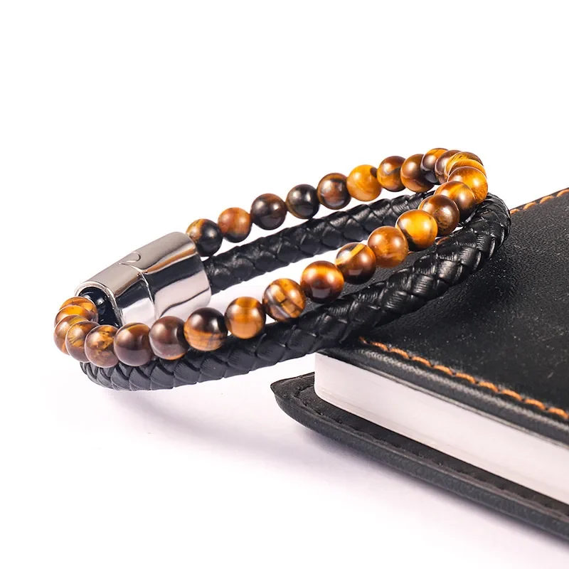 Pulsera con tranza negra y piedras ojo de tigre