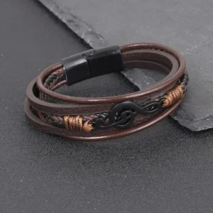 Pulsera marrón de 5 tiras y dije clave de Sol