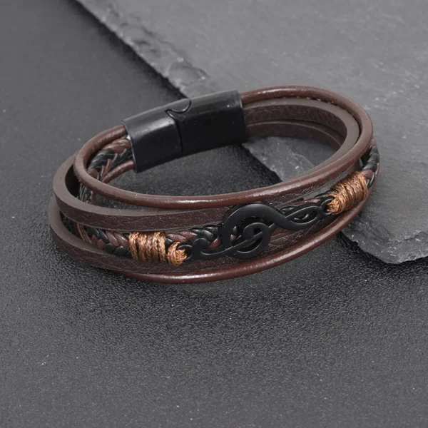 Pulsera marrón de 5 tiras y dije clave de Sol